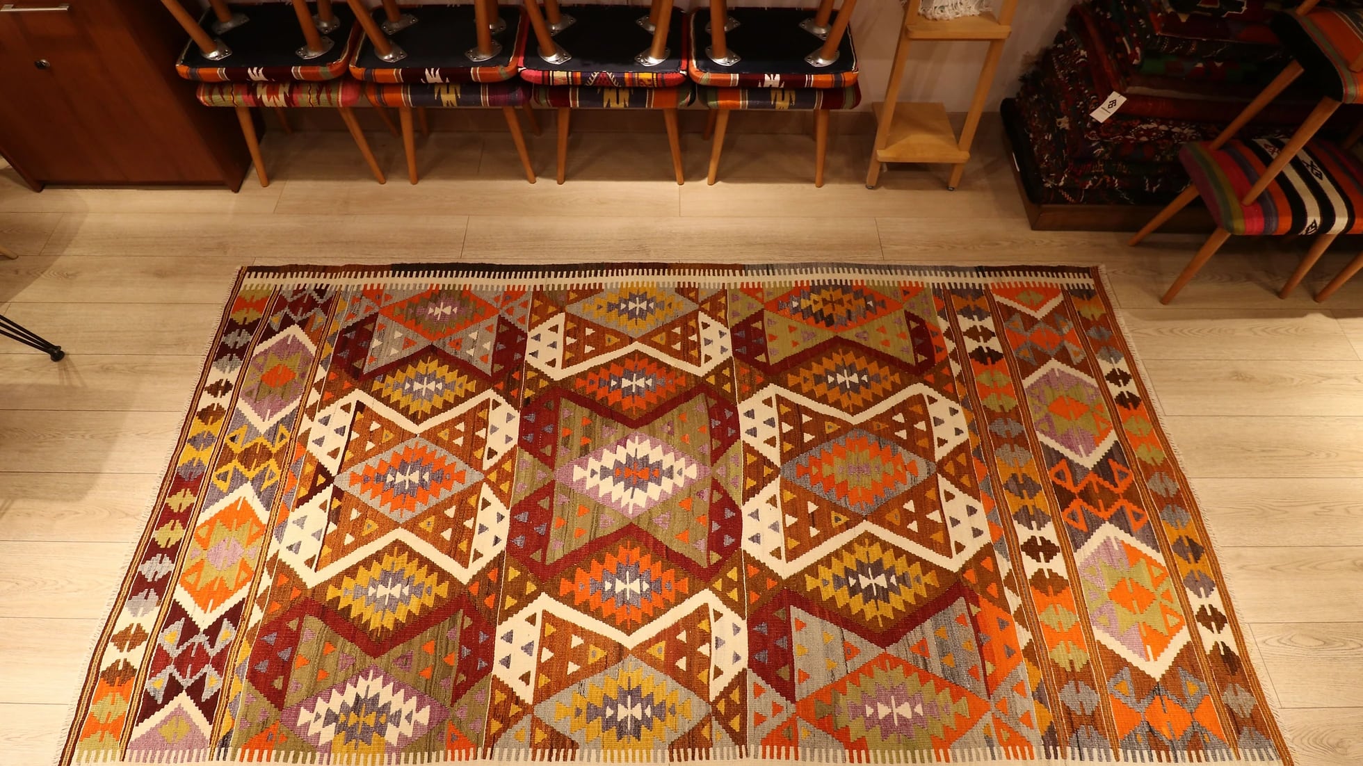 vintage mid-century large area wool kilim rug in pastel earth tones and lozenge patterns