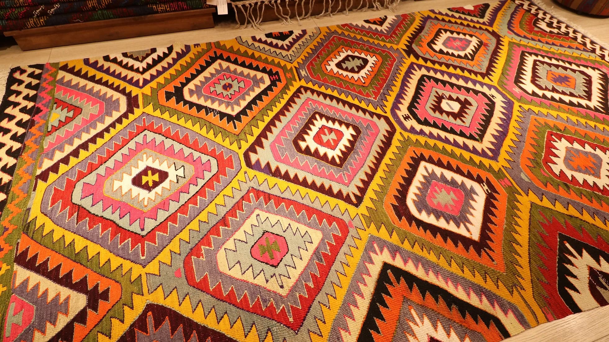 a magnificent mid-century Turkish tribal rug in bright and bold colors and geometric diamond patterns from Antalya
