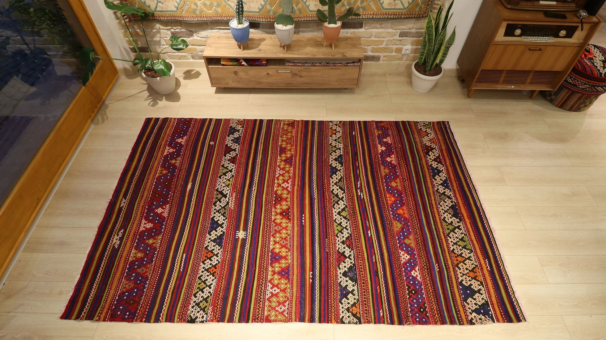 a vibrant and vivid mid-century Turkish kilim rug from Balikesir in traditional patterns and multicolored geometric stripes by Kilim Couture New York rug gallery