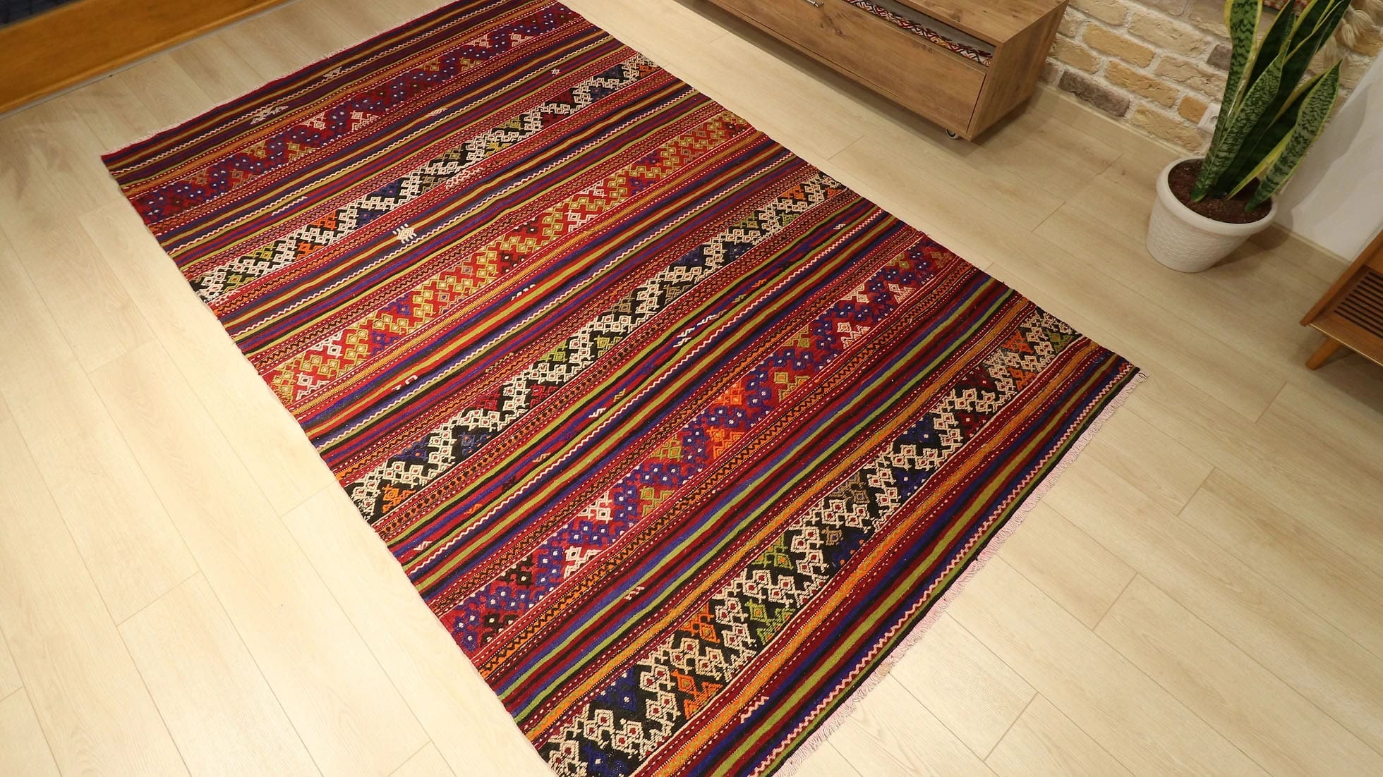 a vibrant and vivid mid-century Turkish kilim rug from Balikesir in traditional patterns and multicolored geometric stripes by Kilim Couture New York rug gallery