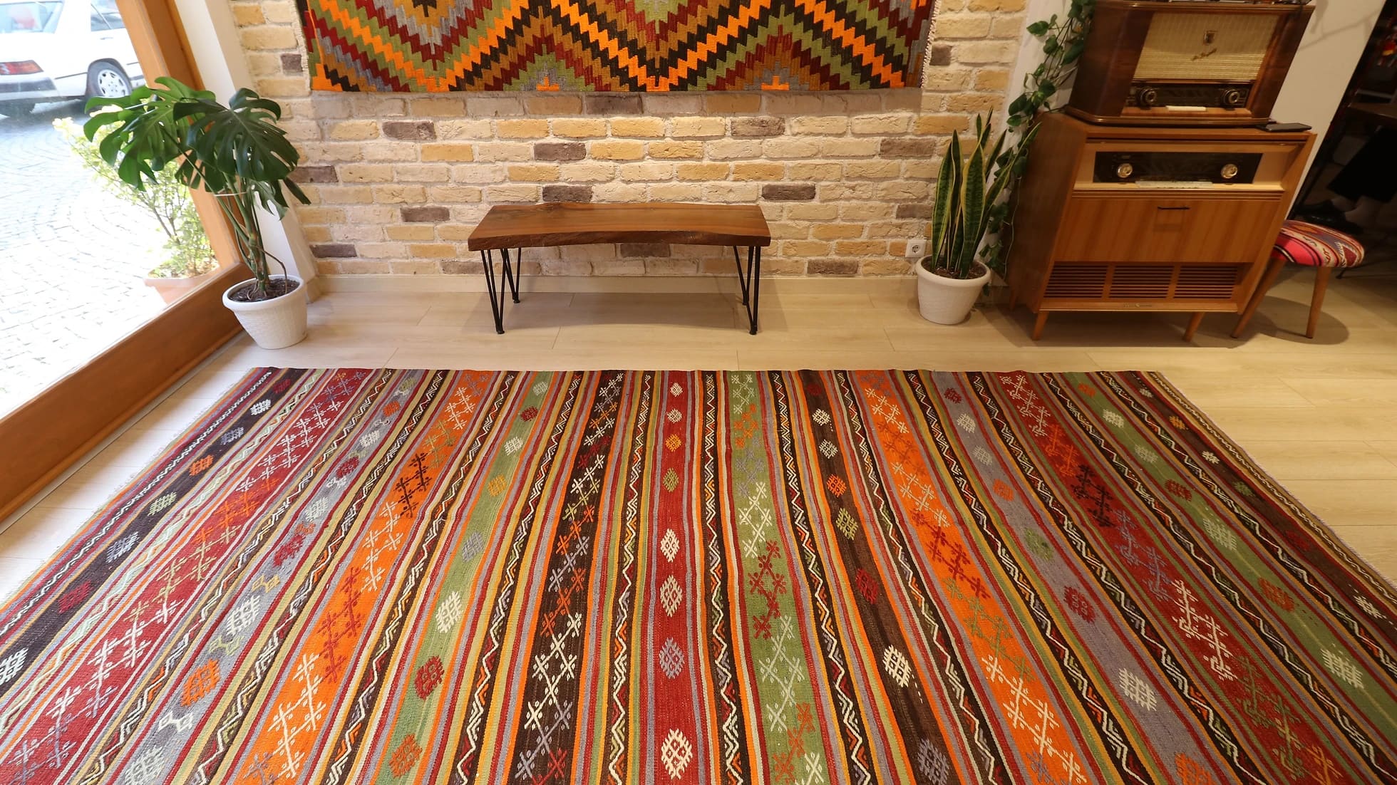 1960s large hallway runner rug in rustic earth tones such as brown, red, orange, gray, and green by Kilim Couture New York