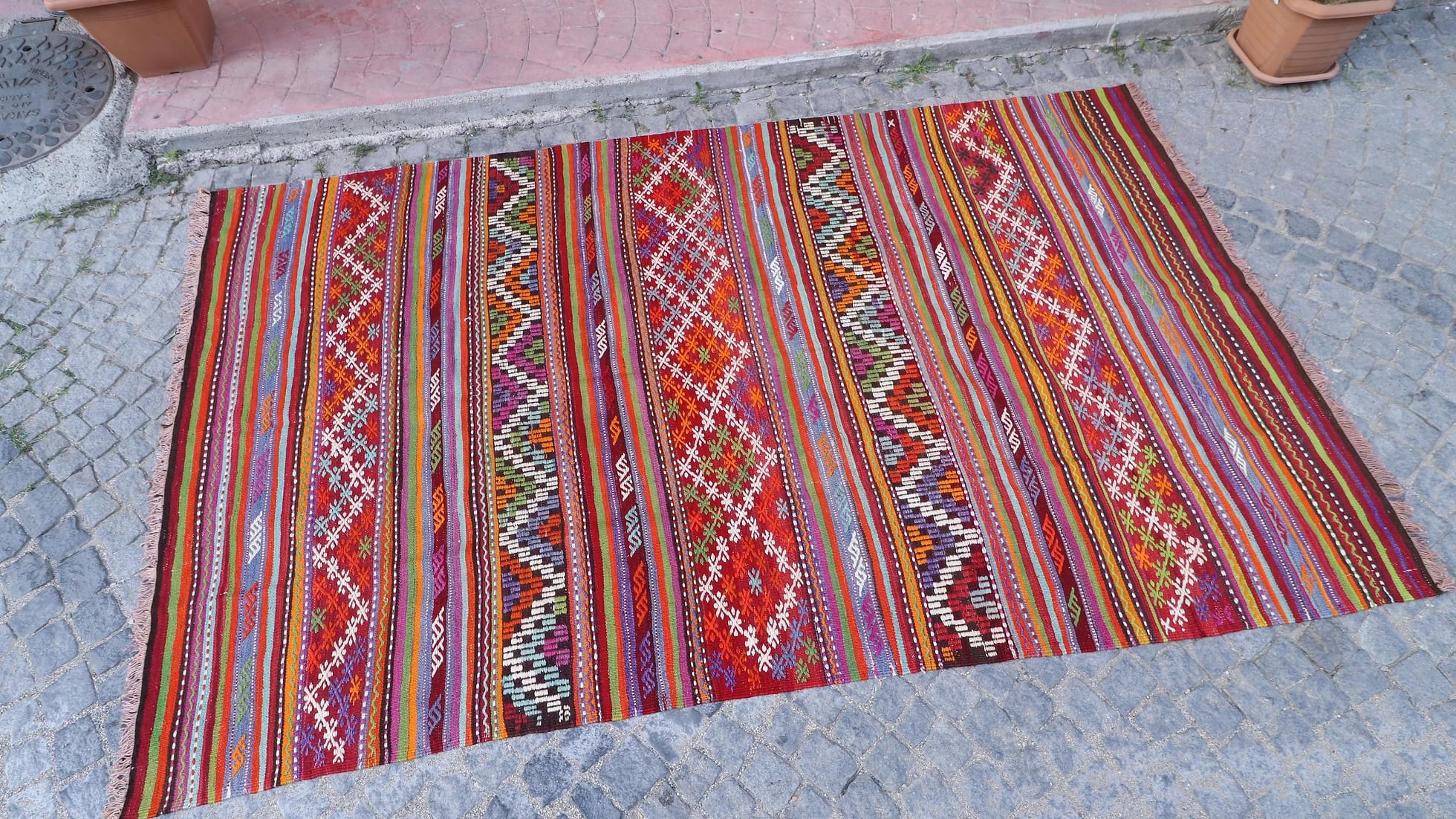 very colorful and pleasing layered and striped balikesir nomadic kilim rug in yoruk style