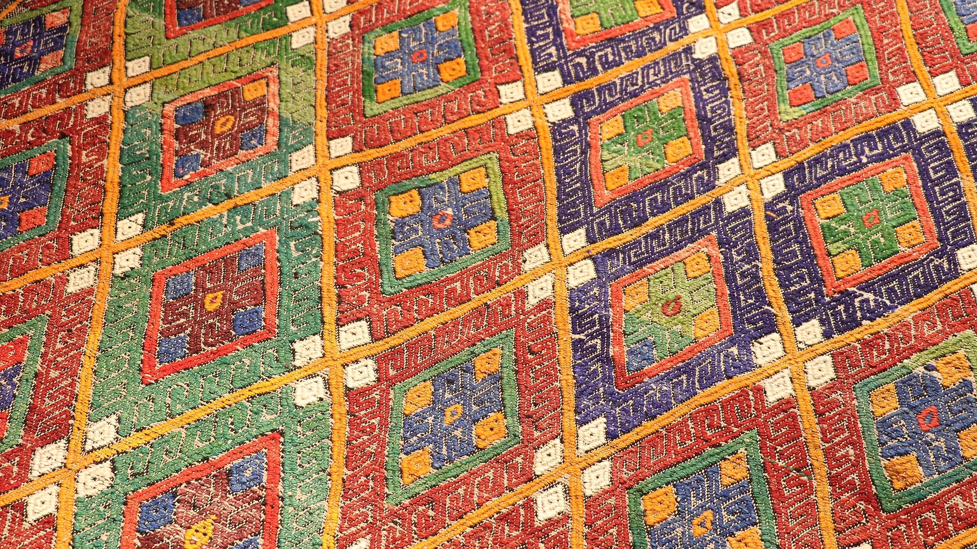 vintage turkish embroidered style Cecim Kilim rug in pastel hues in detail