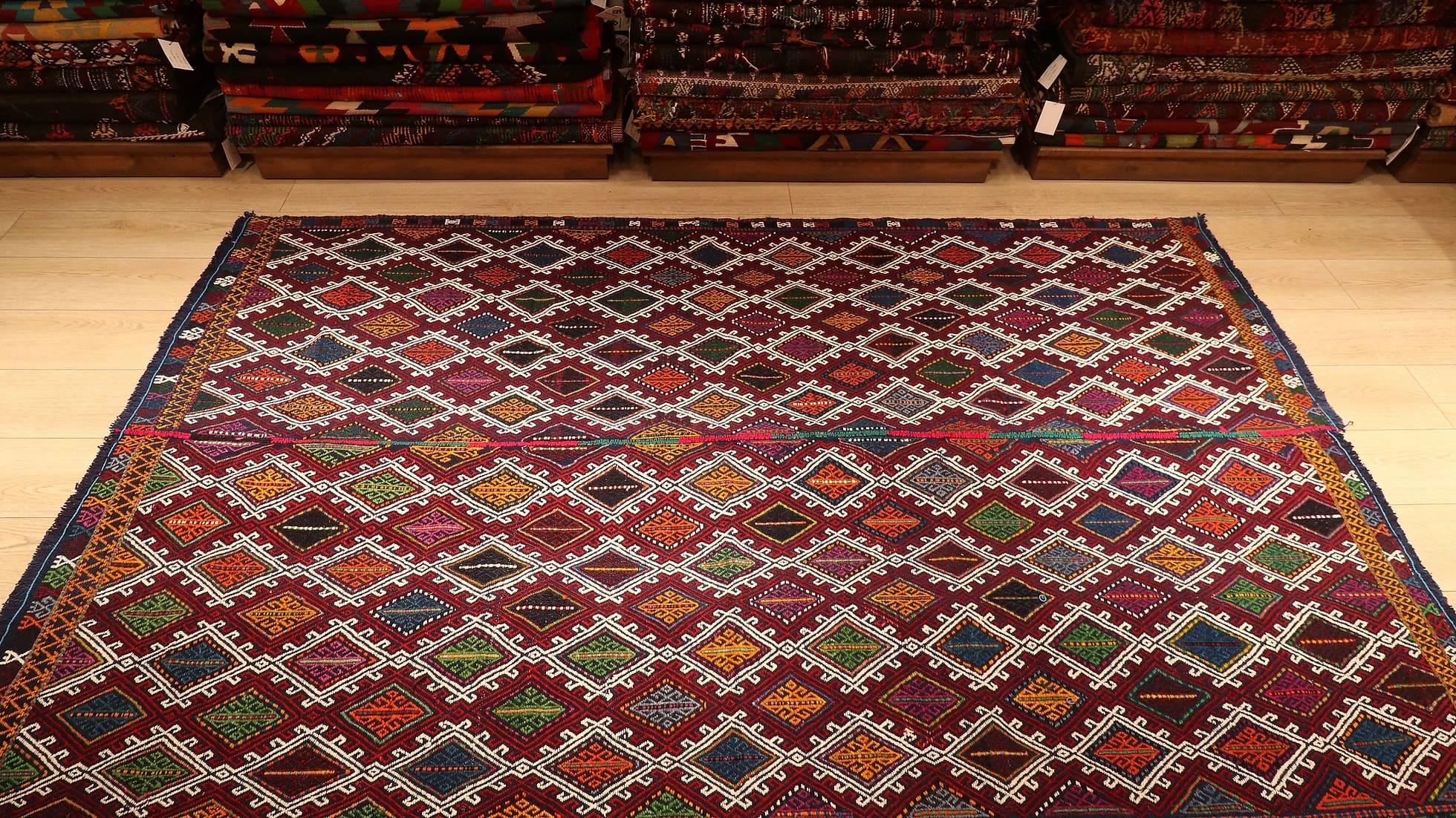 a perfect mid-century tribal Kurdish rug from Denizli, Turkey featuring traditional kilim motifs in muted and faded earth tones