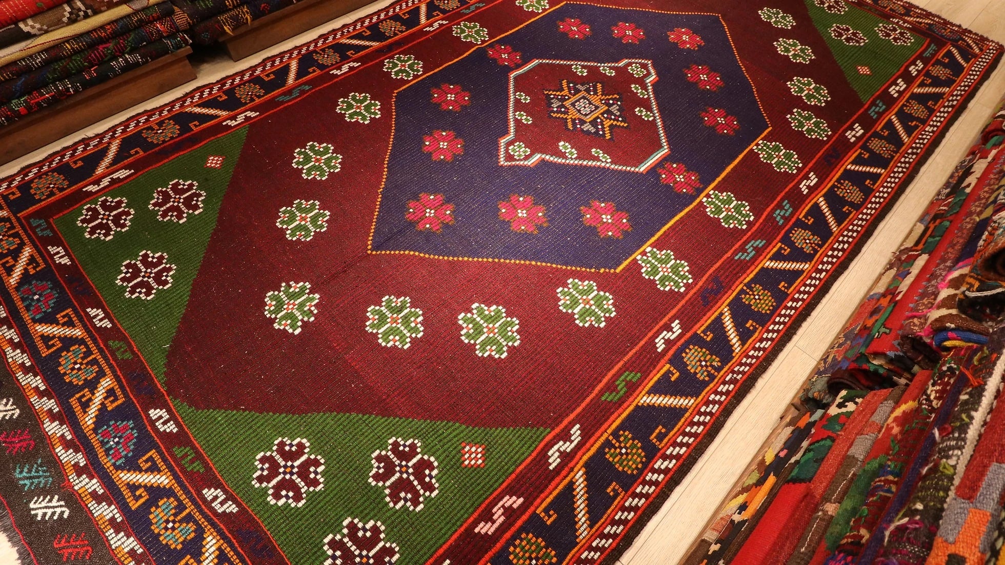 traditional Turkish cecim kilim rug in red, navy, and green handwoven in 1950s