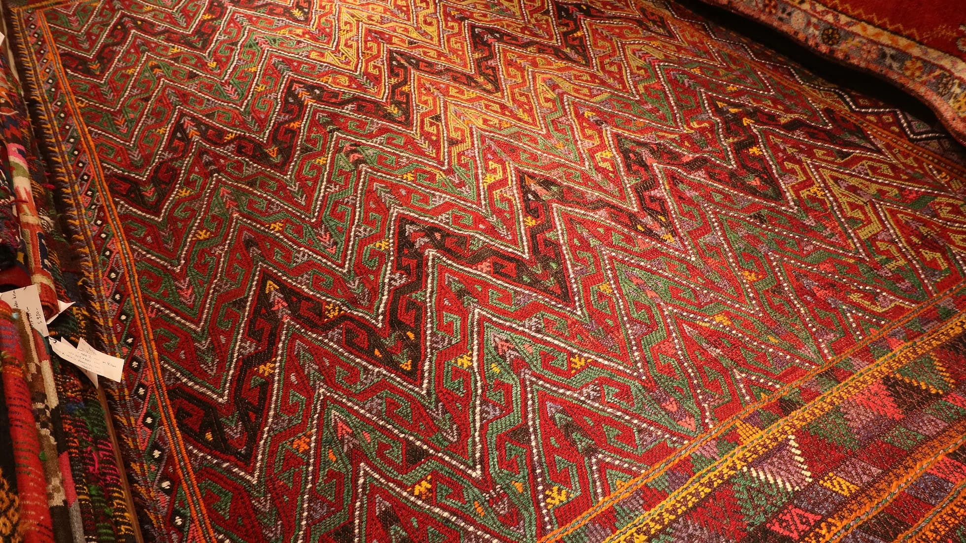 a majestic oriental Kurdish kilim rug in rustic earth tones woven by Anatolian women weavers sustainably