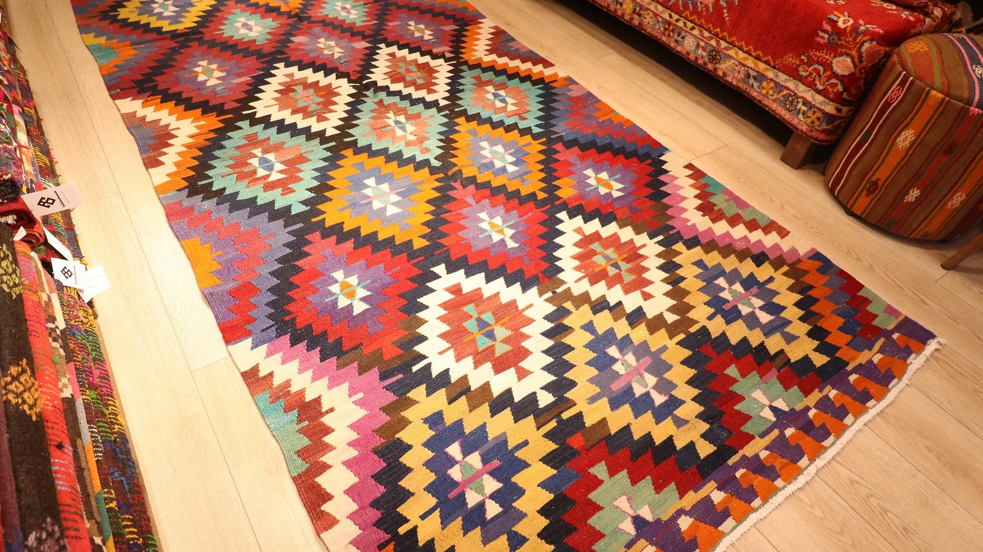 colorful, vibrant, and vivid ethnic Turkish tribal rug in traditional motifs