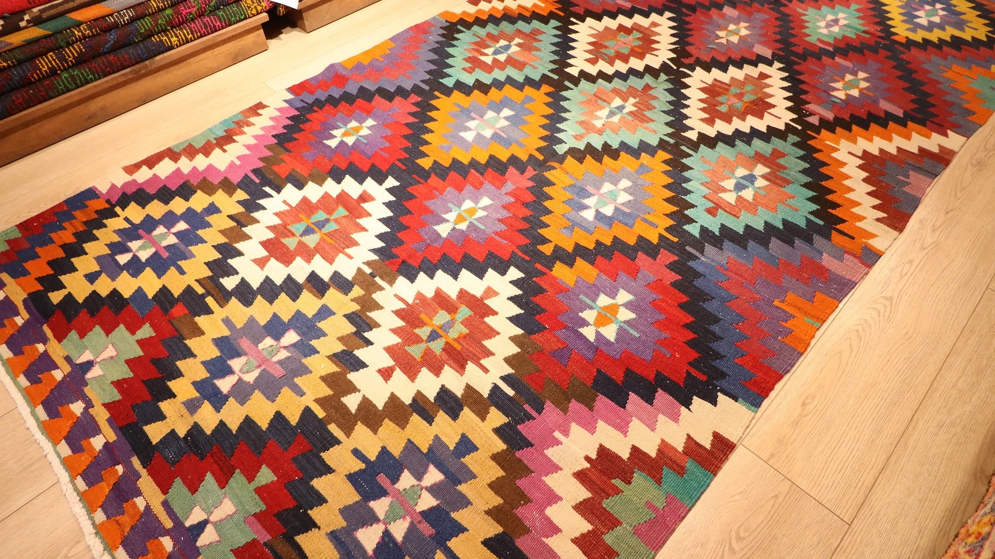 colorful, vibrant, and vivid ethnic Turkish tribal rug in traditional motifs