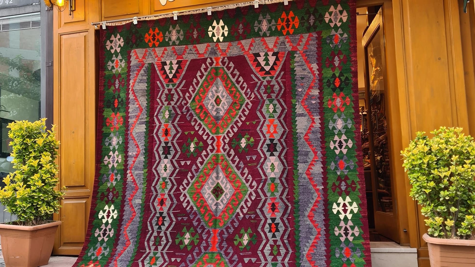 Vintage Handmade Turkish Rug with geometric patterns in red, grey, green in tribal style
