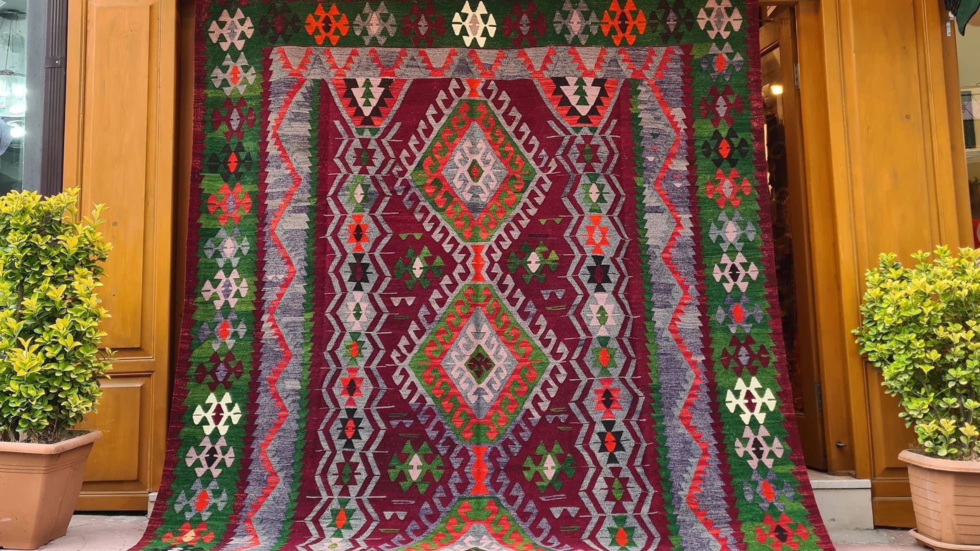 Vintage Handmade Turkish Rug with geometric patterns in red, grey, green in tribal style