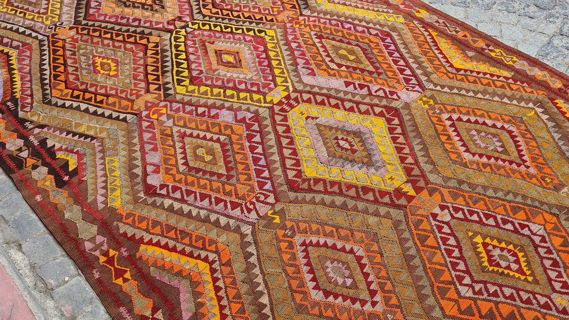 vintage handcrafted turkish tribal rug in yoruk style in saffron yellow and bronze orange from mid-century