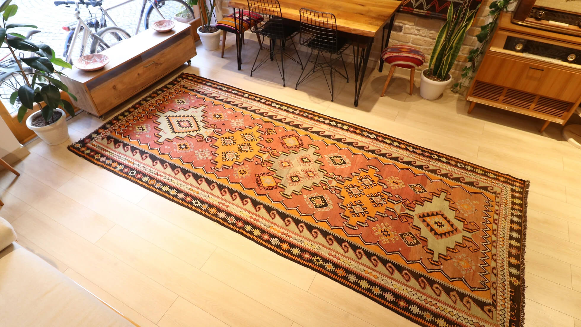 handmade Turkish flat-woven wool rug with tribal quilt patterns