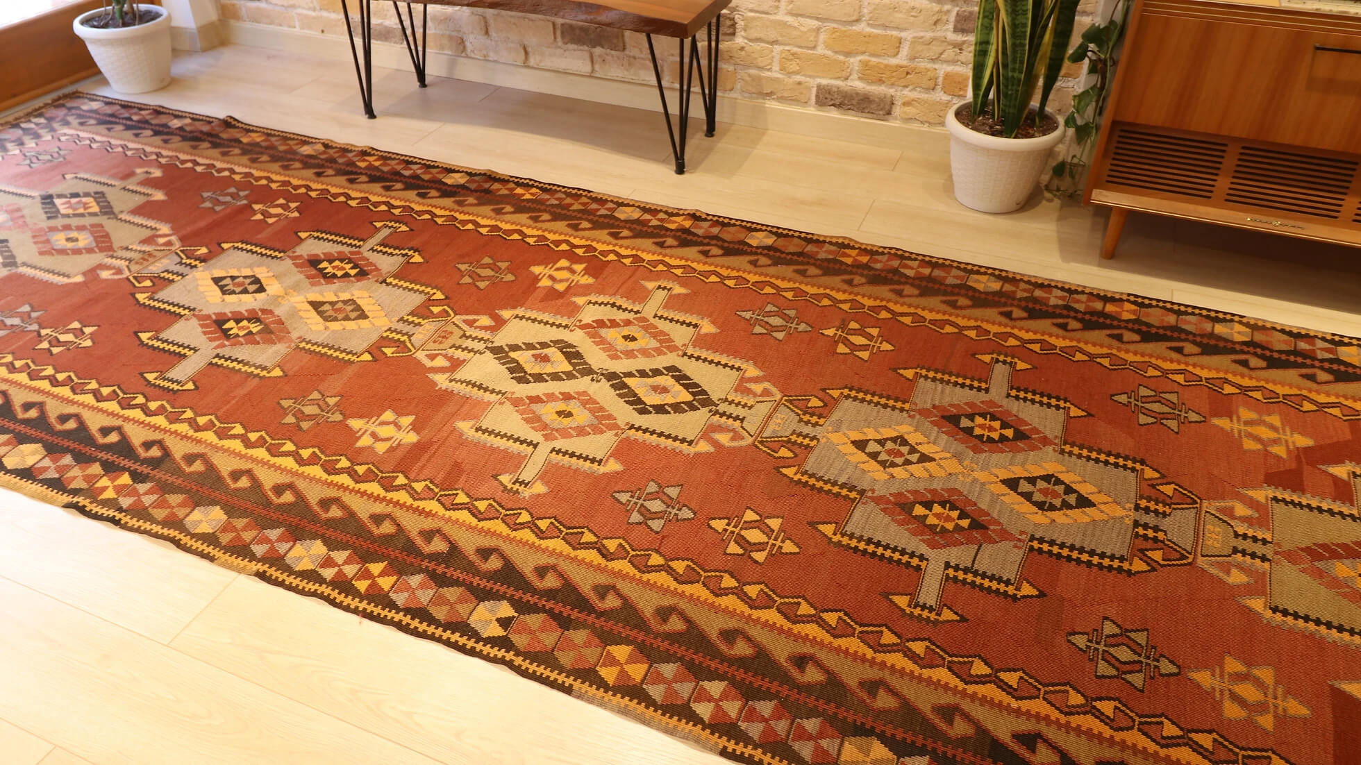 room-sized oversize nomadic Kars gallery runner rug in geometric medallion patterns and muted earth tones