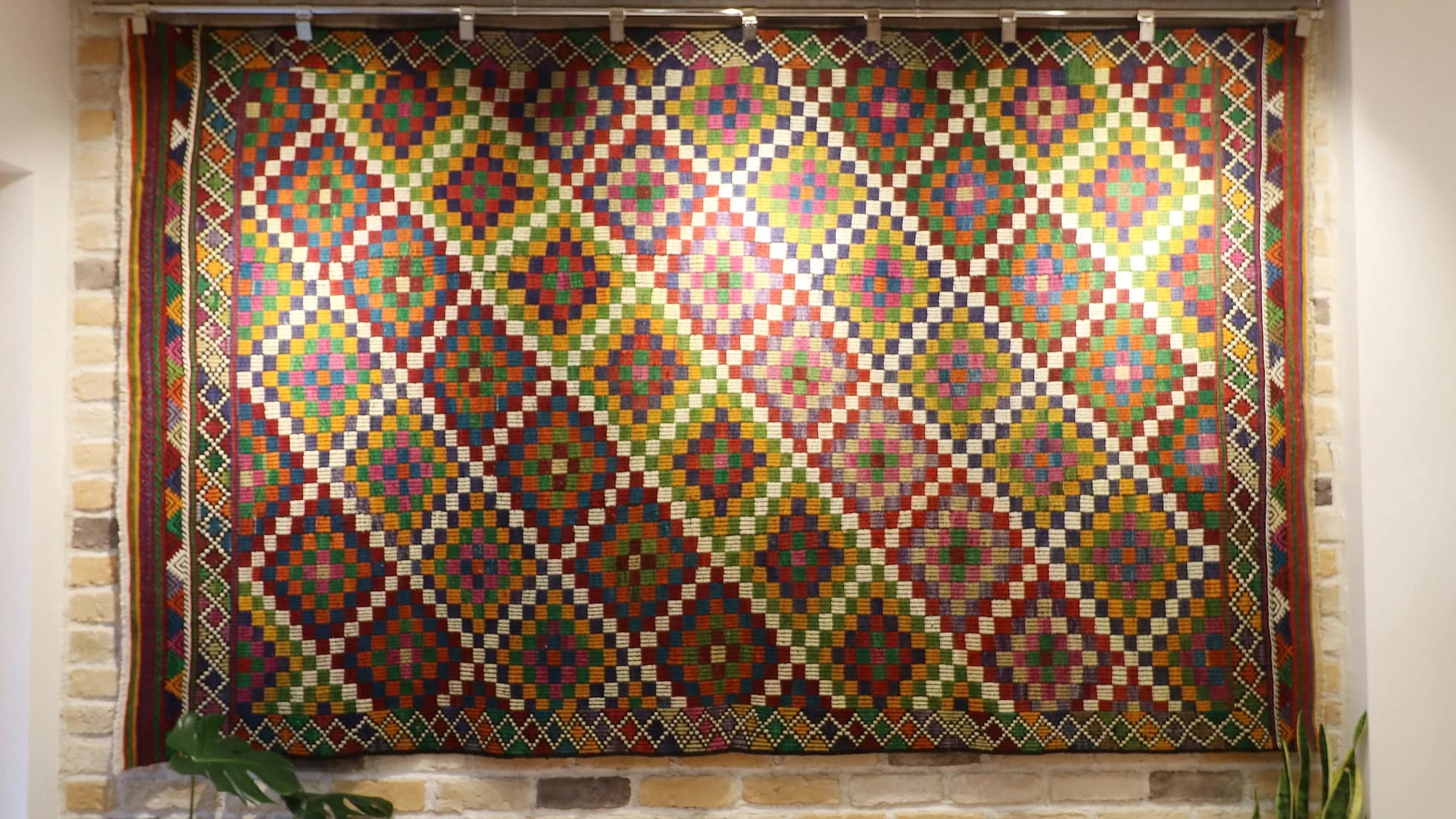 6x9 vintage Turkish cecim kilim rug with lozenge motifs in pink, purple, orange, red, green, and white