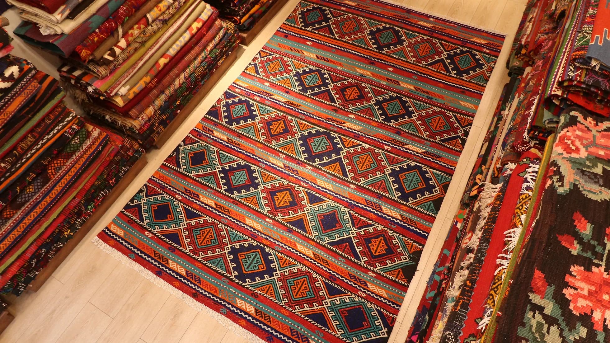 multicolored vintage Turkish tribal rug featuring traditional kilim motifs and modern colors from 1960s era