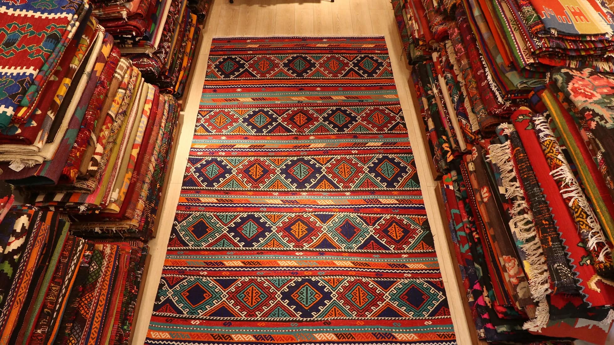 multicolored vintage Turkish tribal rug featuring traditional kilim motifs and modern colors from 1960s era