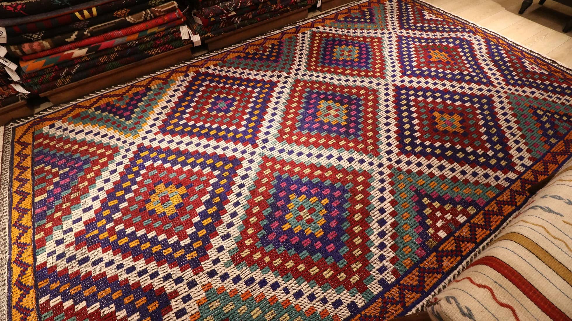 a magnificent vintage mid-century eclectic Turkish rug in many vibrant and vivid colors with traditional kilim motifs