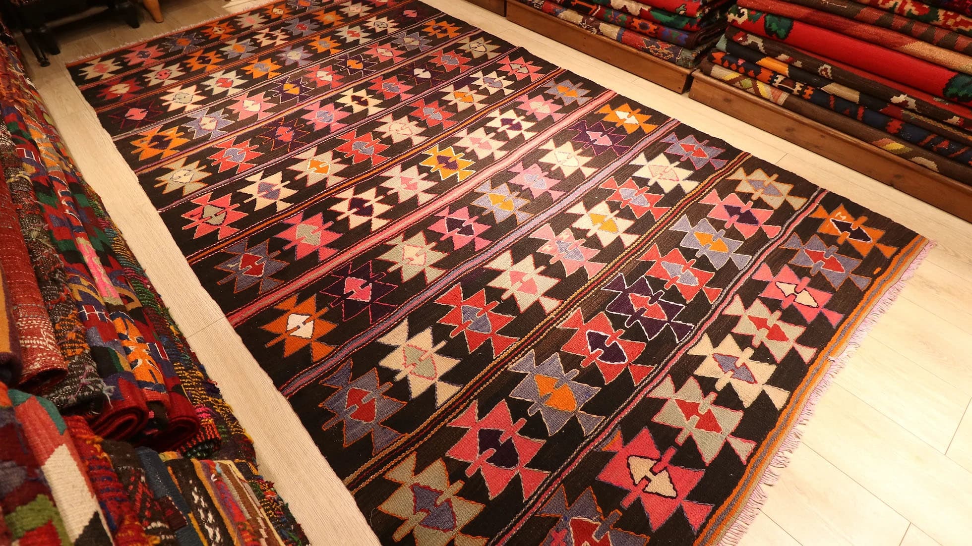 tribal and colorful maximalist vintage mid-century Turkish cecim kilim rug displayed at Kilim Couture New York rug gallery