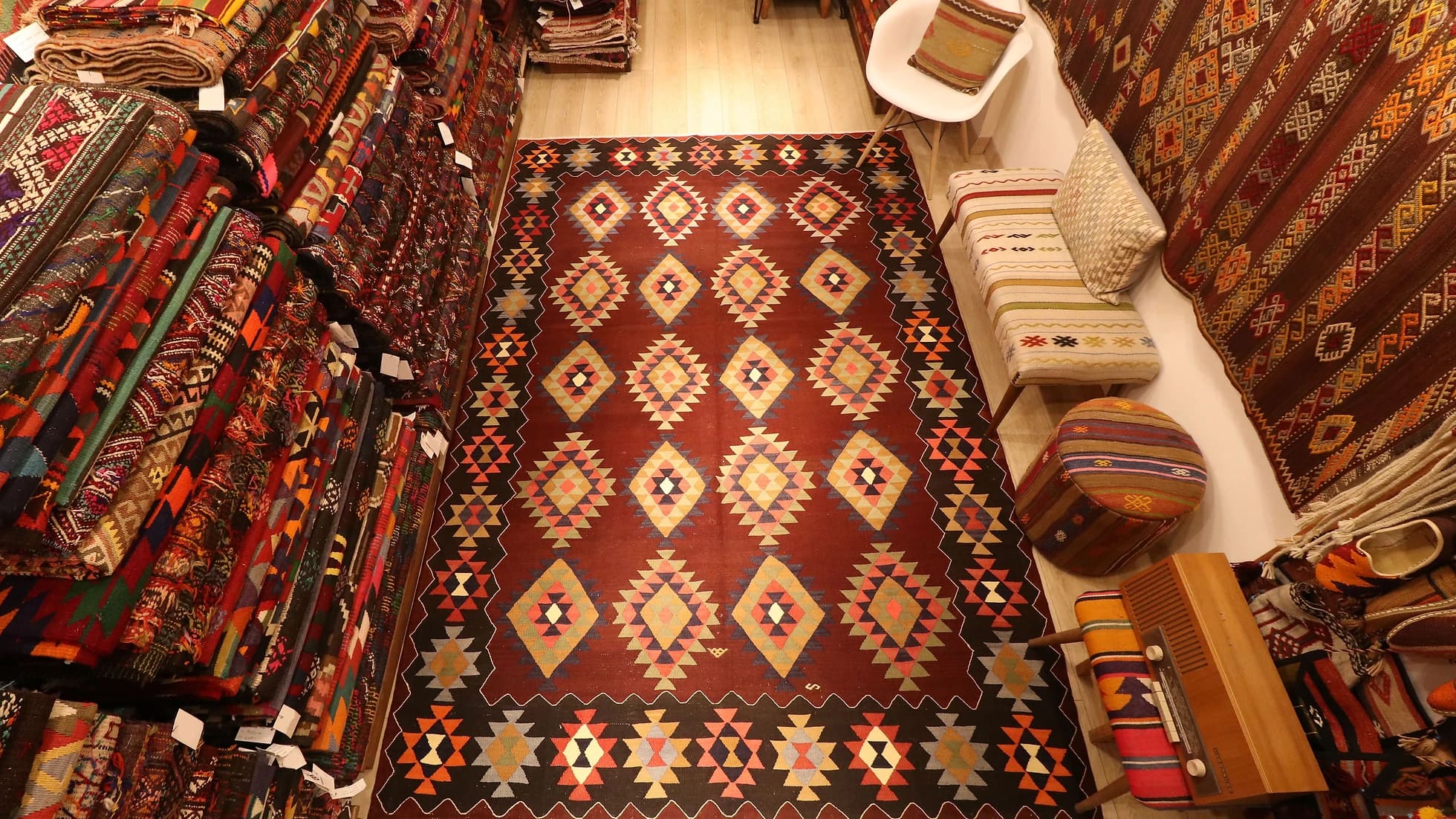 Vintage handwoven oriental Turkish rug in pastel and earth colors adorned with traditional and tribal motifs