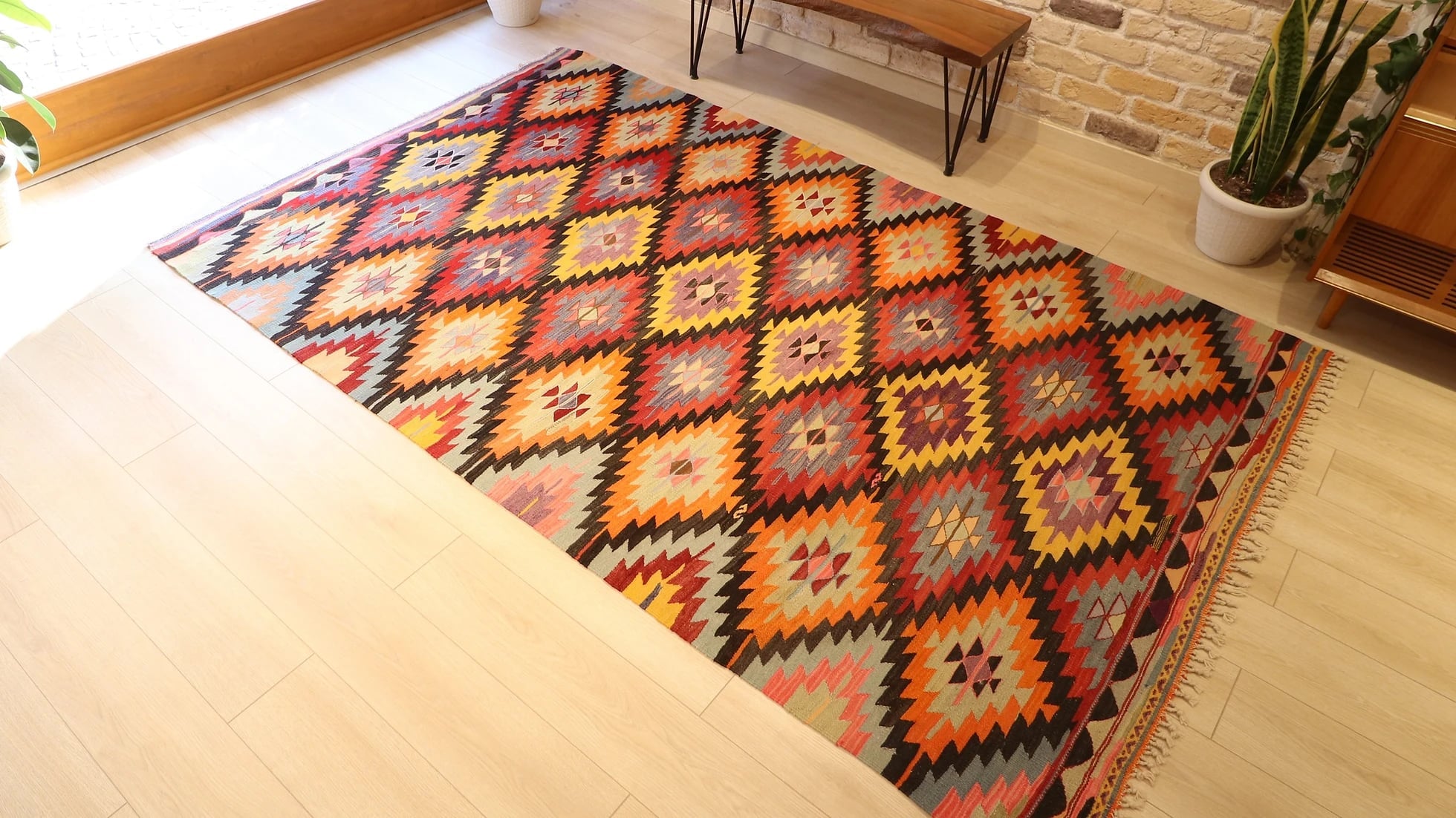 Turkish ethnic tribal rug featuring traditional motifs in vivid and vibrant colors from mid-century