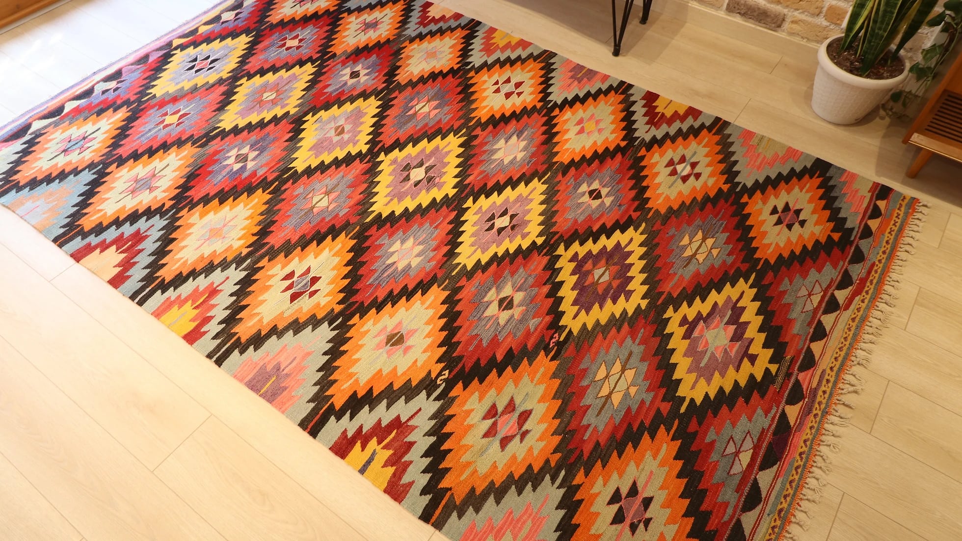 Turkish ethnic tribal rug featuring traditional motifs in vivid and vibrant colors from mid-century