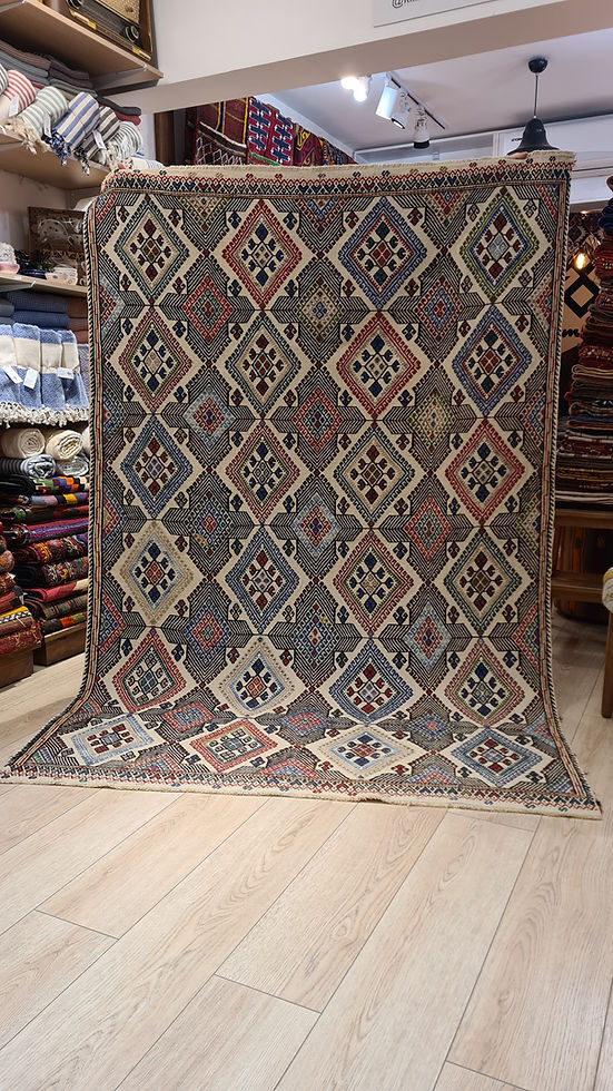Anatolian Mid-Century Kilim rug in excellent condition, featuring intricate diamond patterns and natural earth tones, ideal for both modern and traditional interiors.