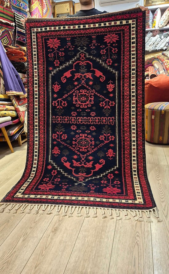 vintage Yagcibedir rug with floral stars and motifs, curated for designers