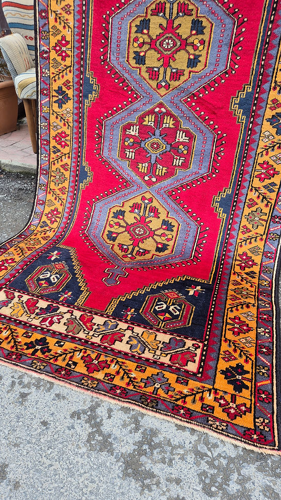 Yahyali wool rug from Kayseri, Turkey featuring geometric medallions in madder red