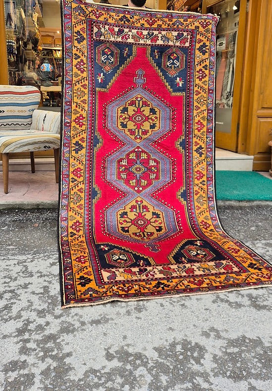 Vintage Turkish hand-knotted Yahyali oriental rug in madder red, saffron gold, and midnight blue