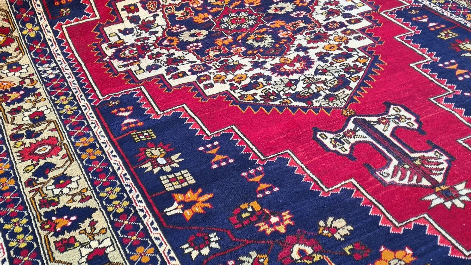 luxurious turkish oreintal carpet in red and blue by Kilim Couture New York