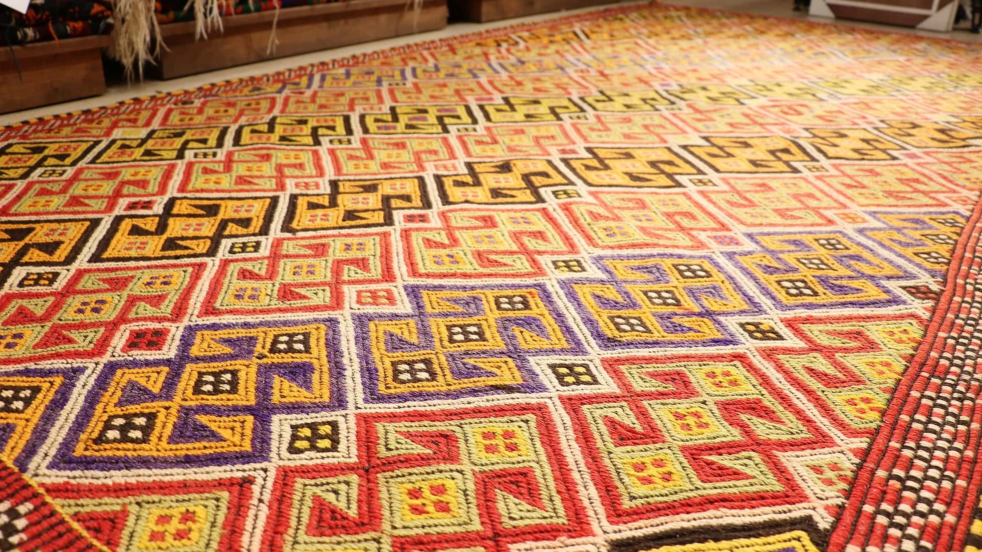colorful handwoven oriental turkish rug in wool featuring traditional tribal motifs from the mid-century