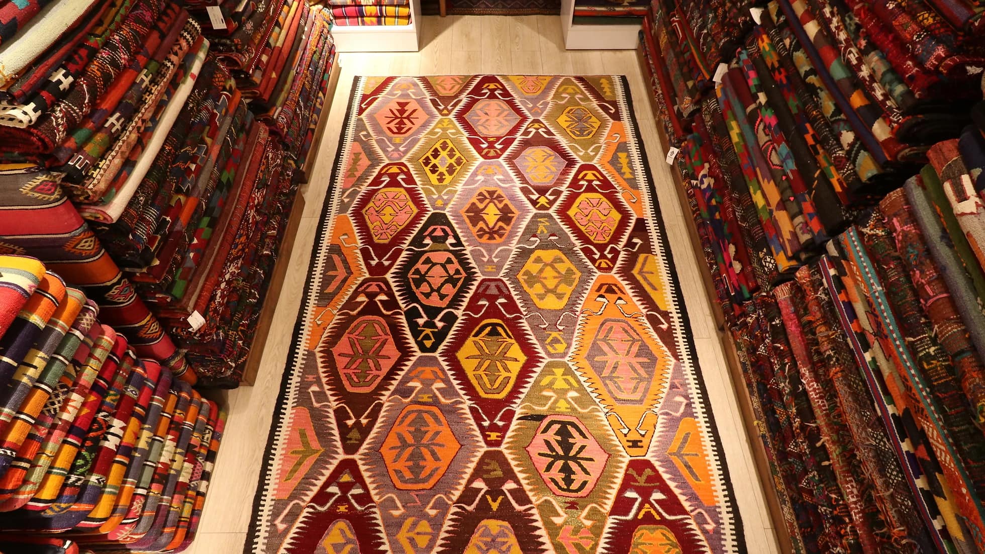 magnificent Turkish tribal kilim rug in pastel and rustic earthy colored medallions and traditional motifs from a vibrant mediterranean city Antalya