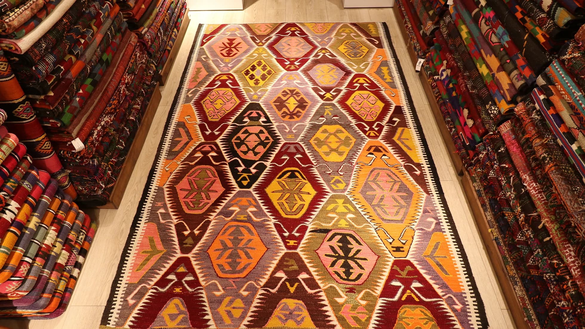 magnificent Turkish tribal kilim rug in pastel and rustic earthy colored medallions and traditional motifs from a vibrant mediterranean city Antalya