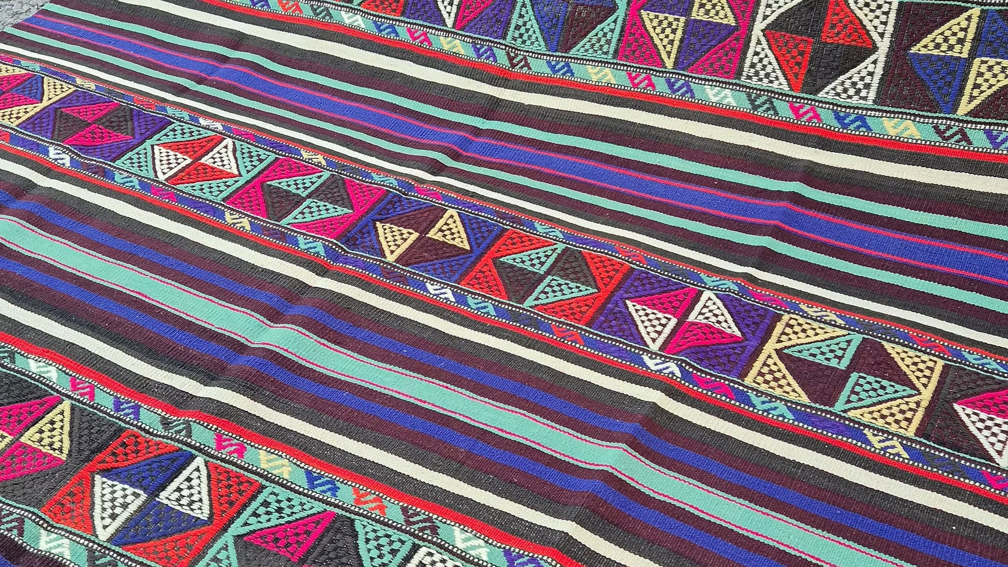 Colorful turkish textile kilim with geometric patterns and stripes