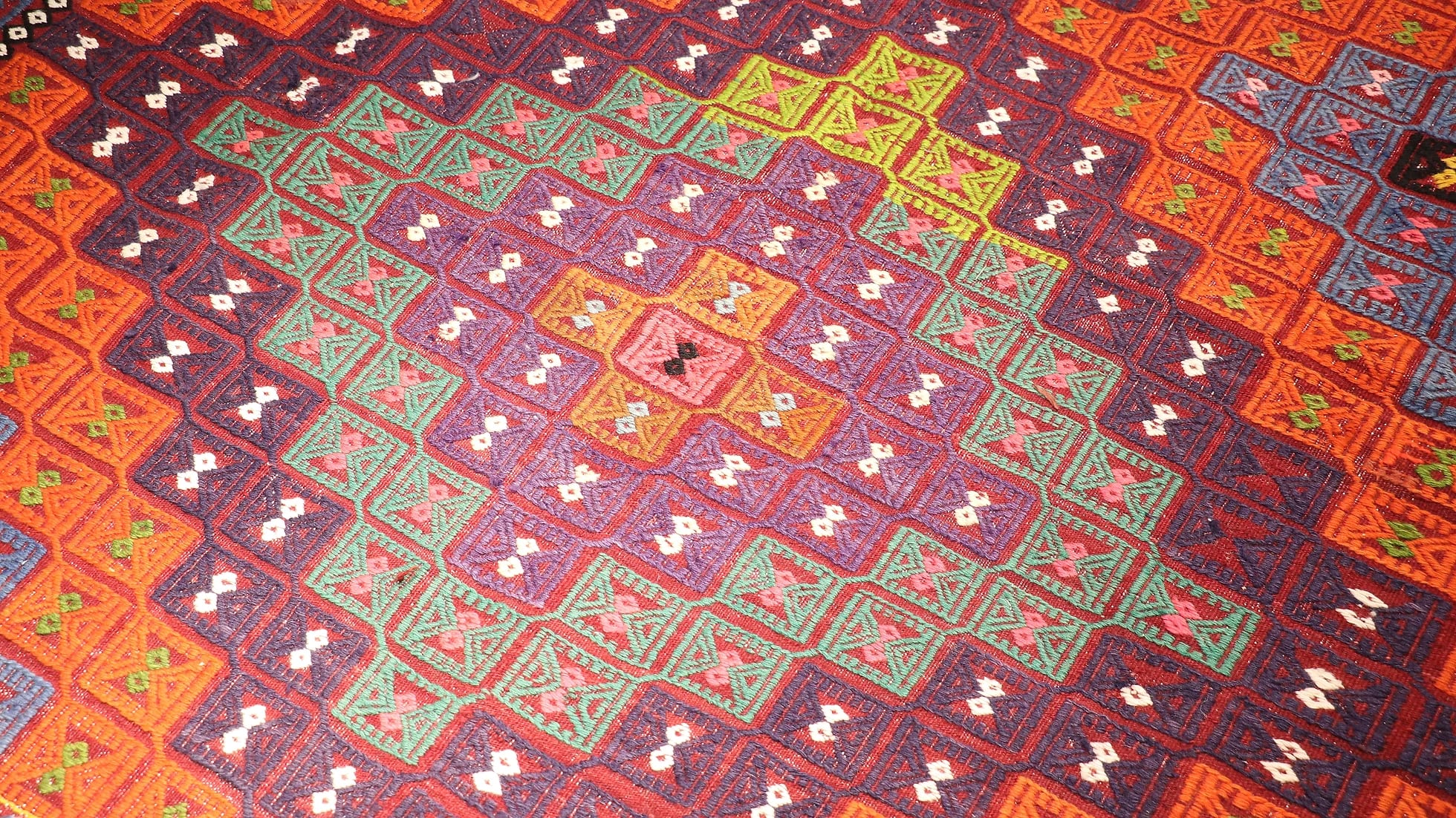 a very colorful vibrant and vivid handwoven cecim mid-century rug from Turkey by Kilim Couture New York