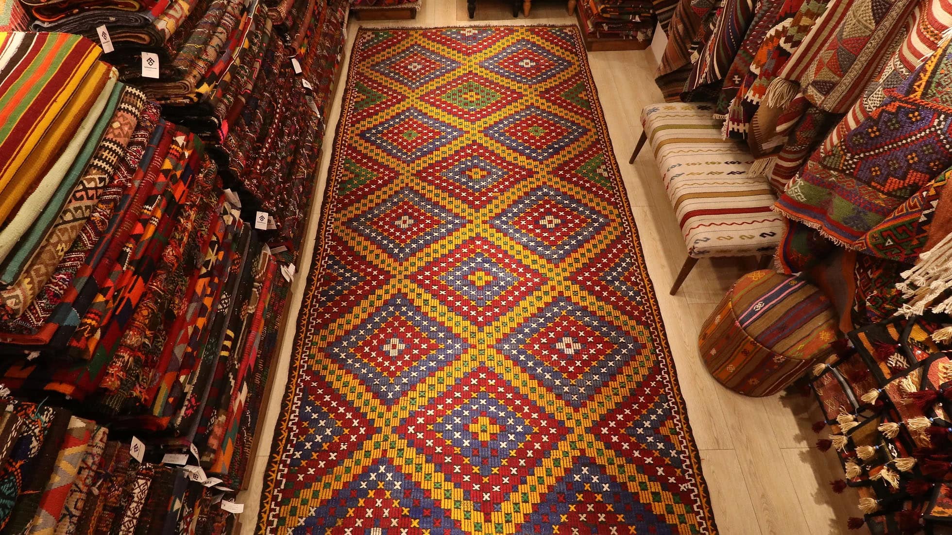 a very intricate and prestigious handwoven embroidered Kurdish runner rug from 1960s by KCNY