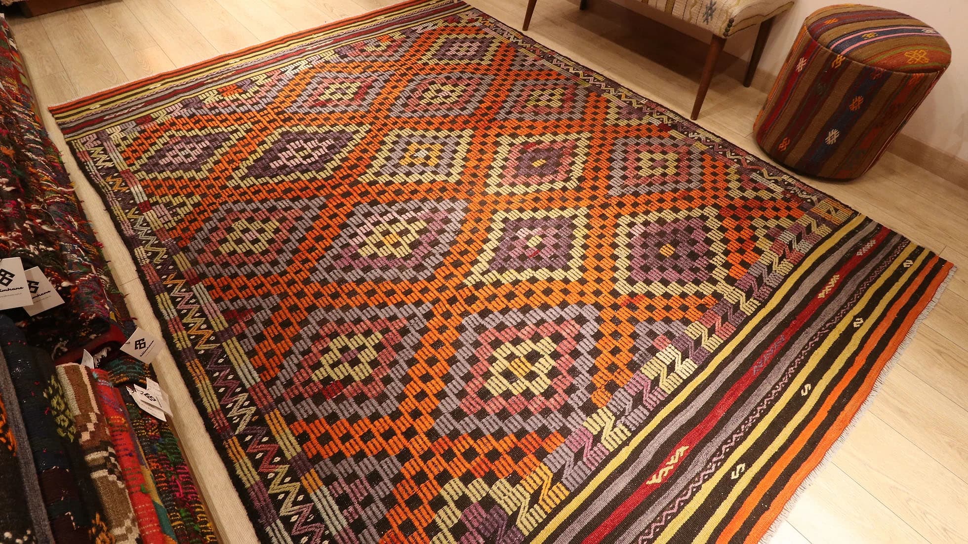 Turkish Handwoven Wool Rug in Orange, Purple, and Ivory measuring 6x8
