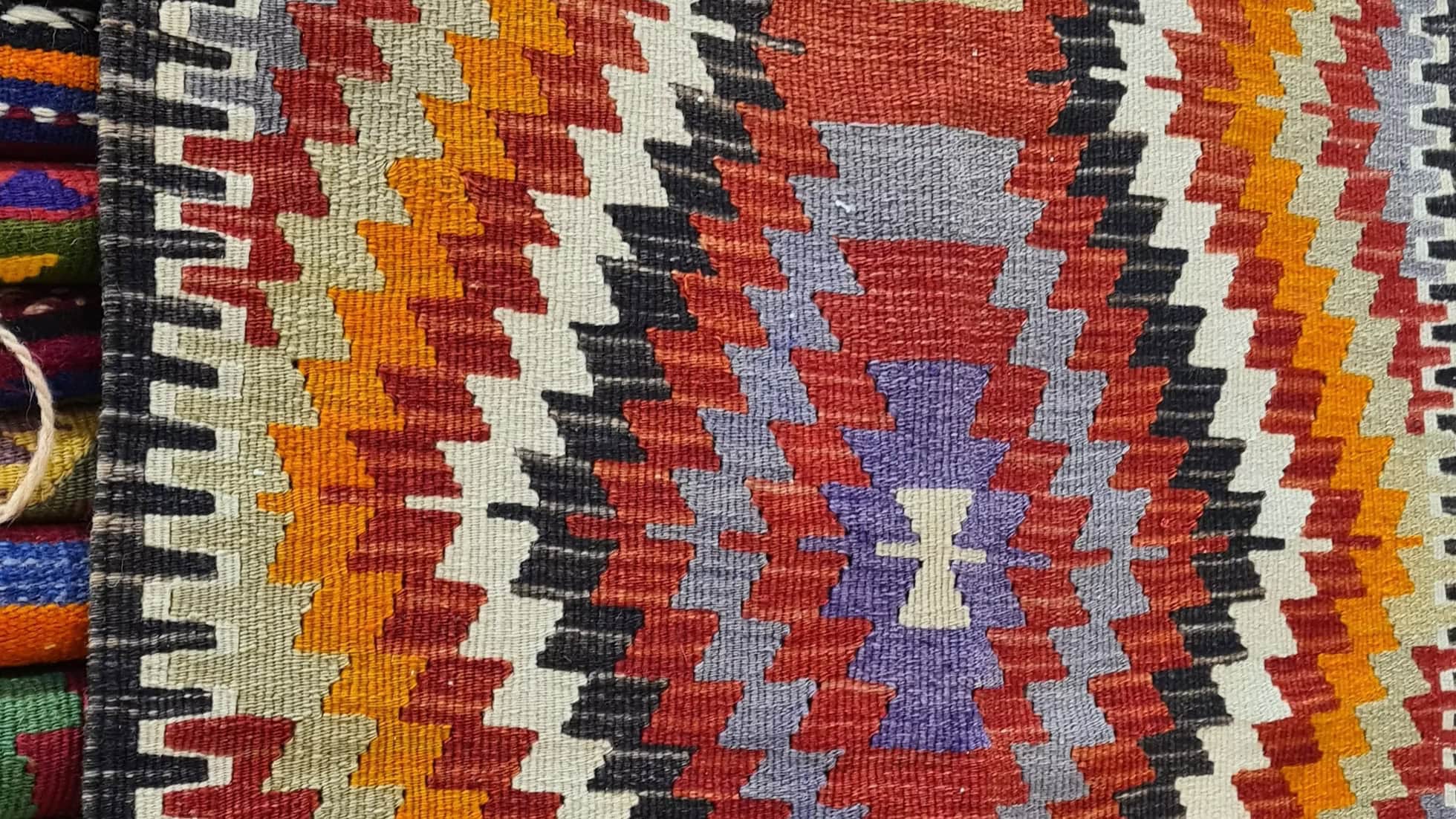 tribal small kilim rug with lozenge pattern