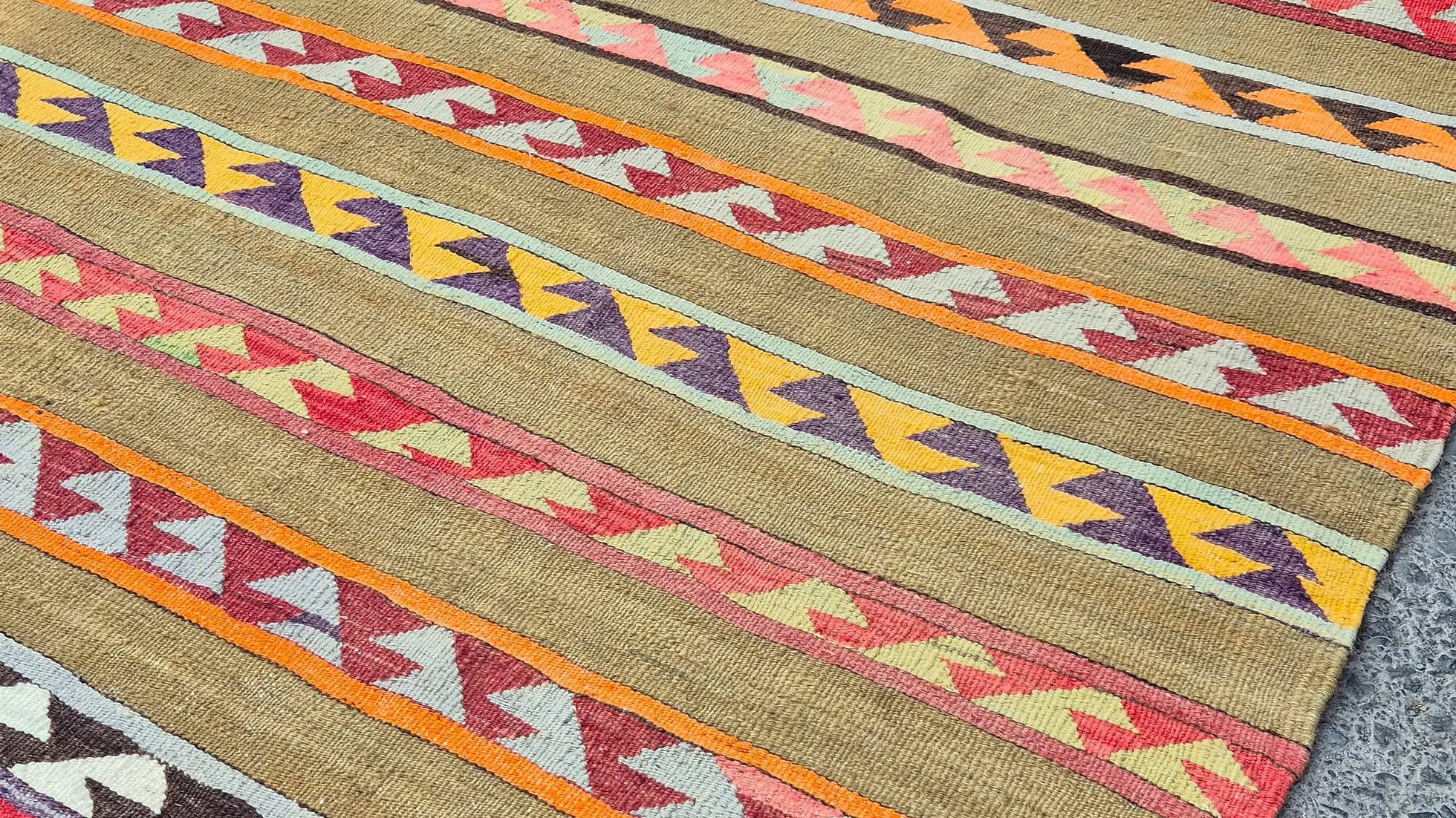 Close-up of antique tribal Anatolian rug with hook motifs by Kilim Couture New York Rug Store