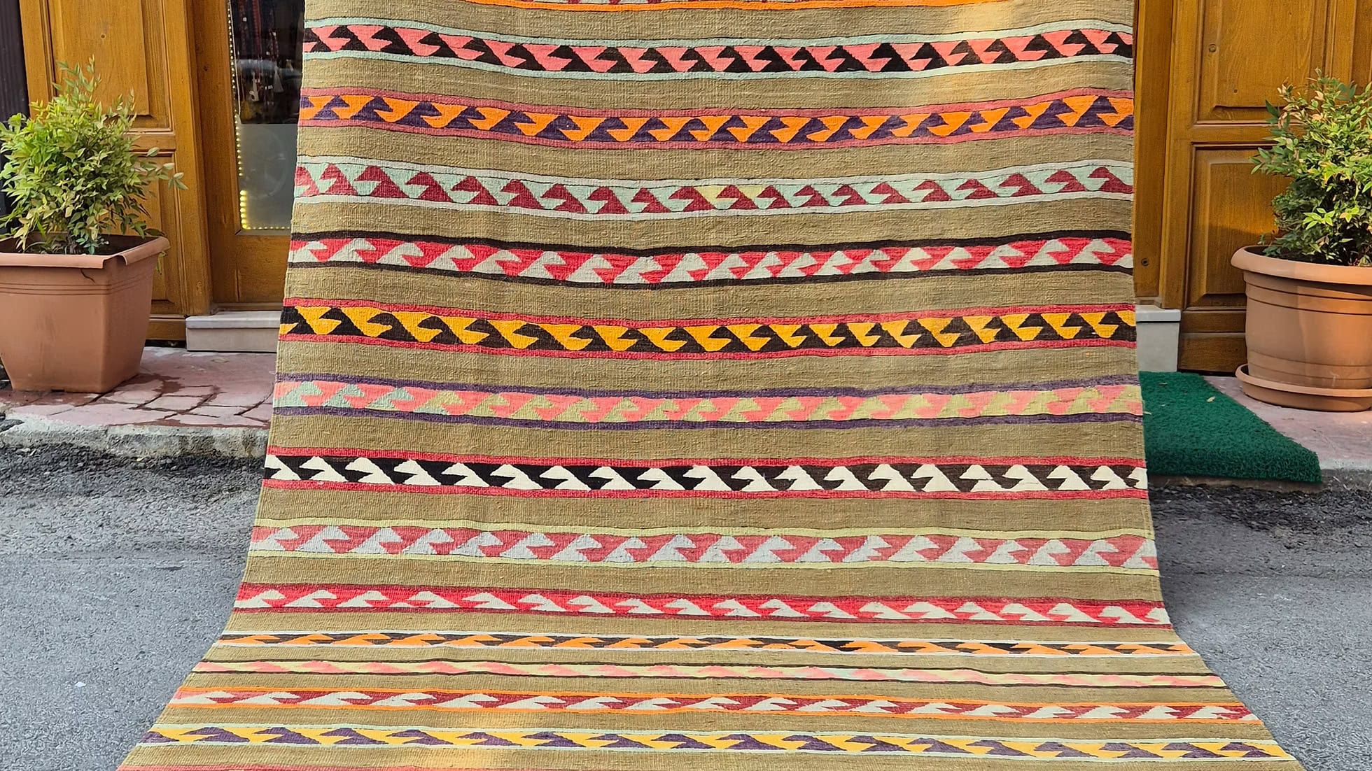 Vintage Turkish Balıkesir flat-weave kilim rug from 1930s, handwoven wool rug with tribal patterns and olive khaki ground