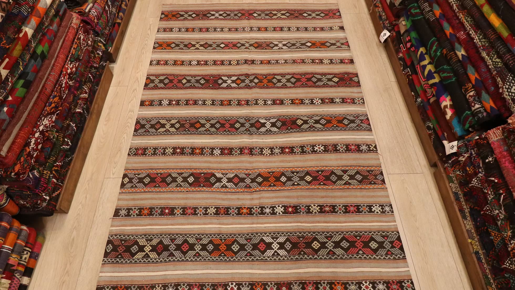 5x7 Handwoven Vintage Turkish Area Rug, featuring intricate motifs and a bold design. A beautiful addition to any home decor, from Kilim Couture’s exclusive collection of antique rugs.