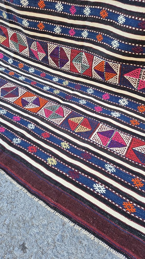 Collector’s semi antique kilim 5x8—handwoven, striped pattern, and rich, contrast color palette.