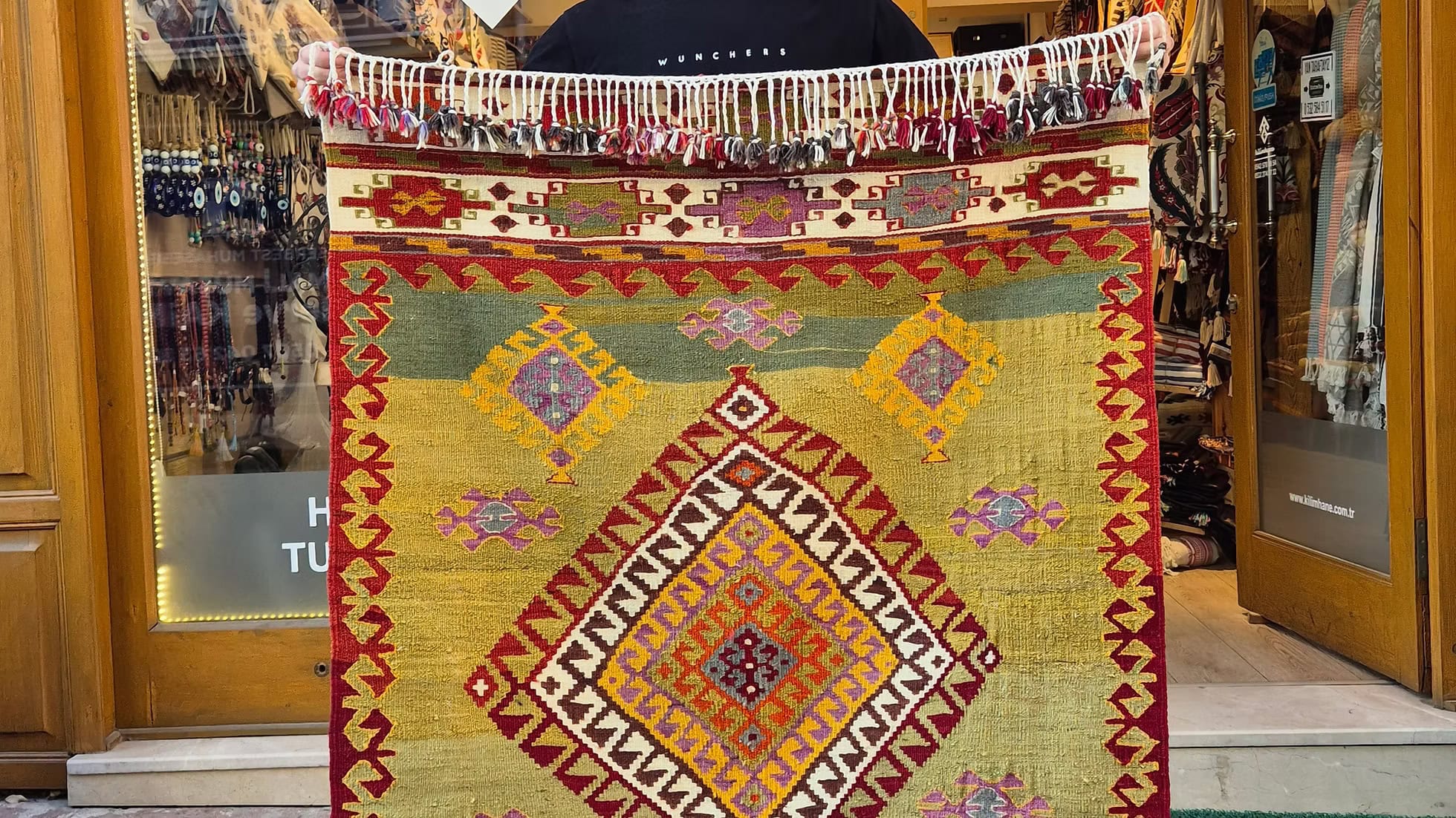 Flat-woven vintage Turkish rug in pastel pistachio and soft mauve, elevating coastal interiors, sunlit retreats, luxury Hamptons homes, and beach cottages