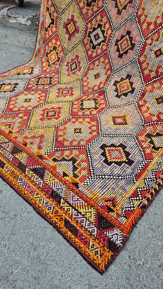 Close-up of a vintage Turkish Cecim kilim Rug in terracotta and denim tones—ideal for farmhouse interiors with rustic character.