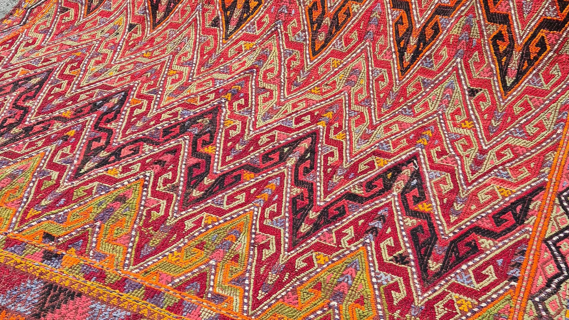Bold and painterly Turkish kilim rug showcasing tribal patterns — a perfect addition for interior and set decorators seeking a textured, layered look.