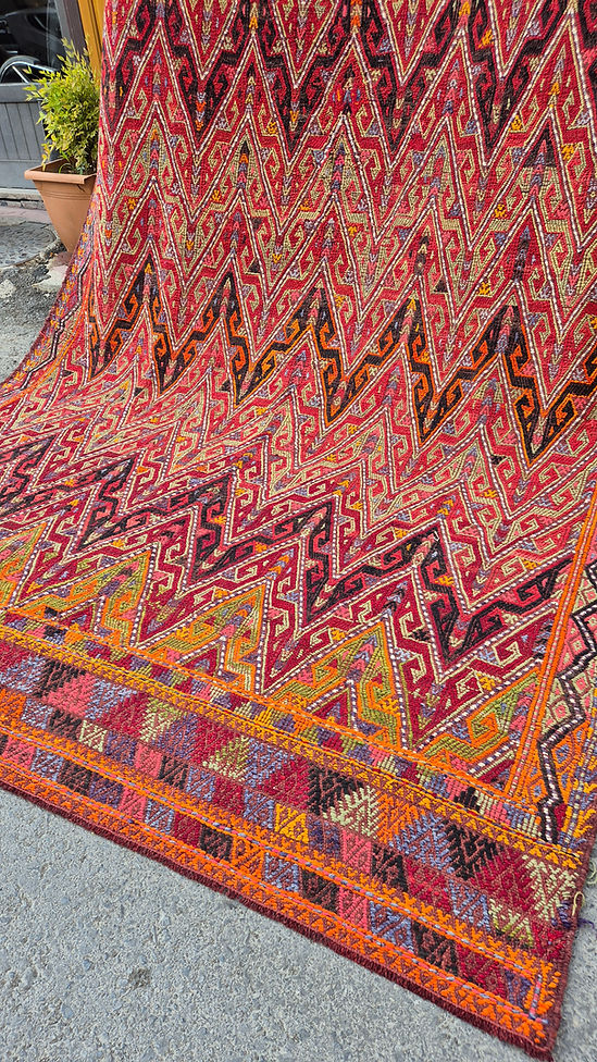 Bold and painterly Turkish kilim rug showcasing tribal patterns — a perfect addition for interior and set decorators seeking a textured, layered look.