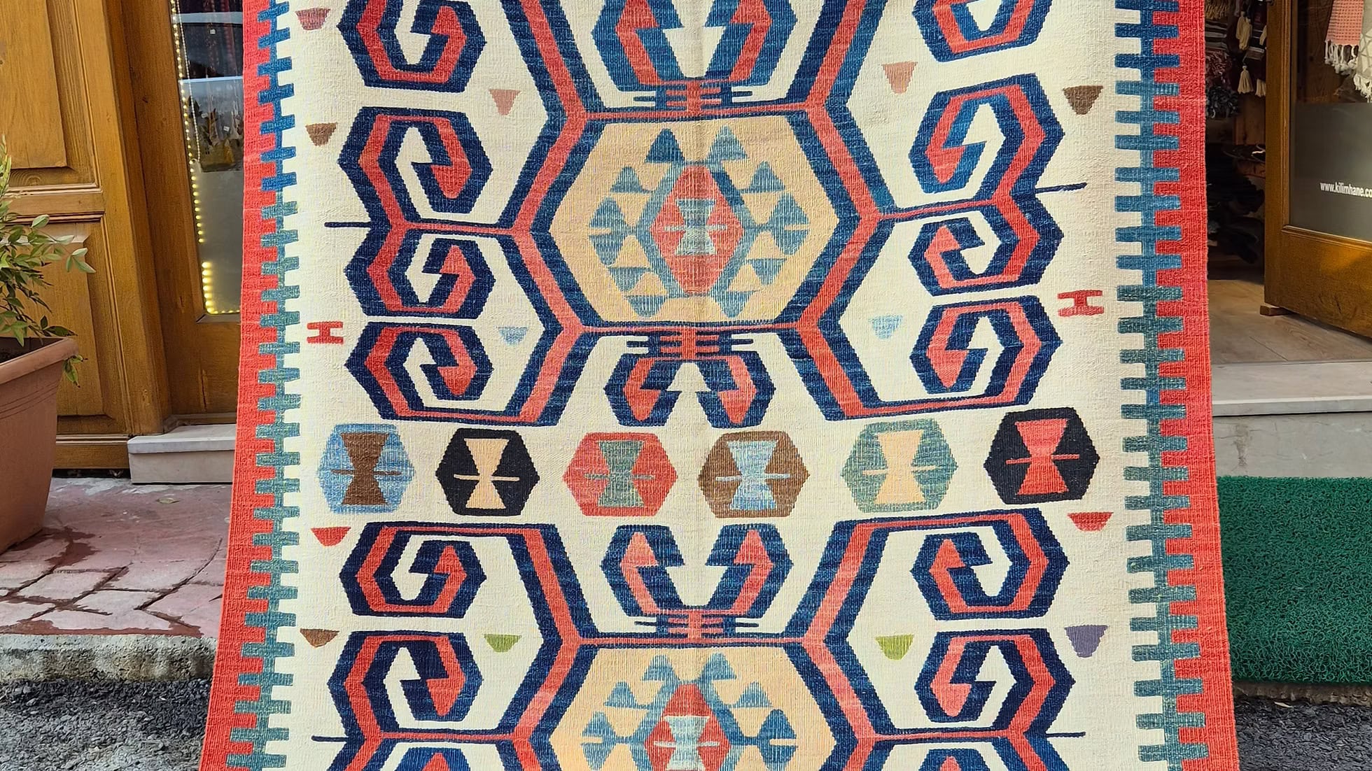 Decorative traditional Turkish medium area rug with geometric pattern by Kilim Couture New York
