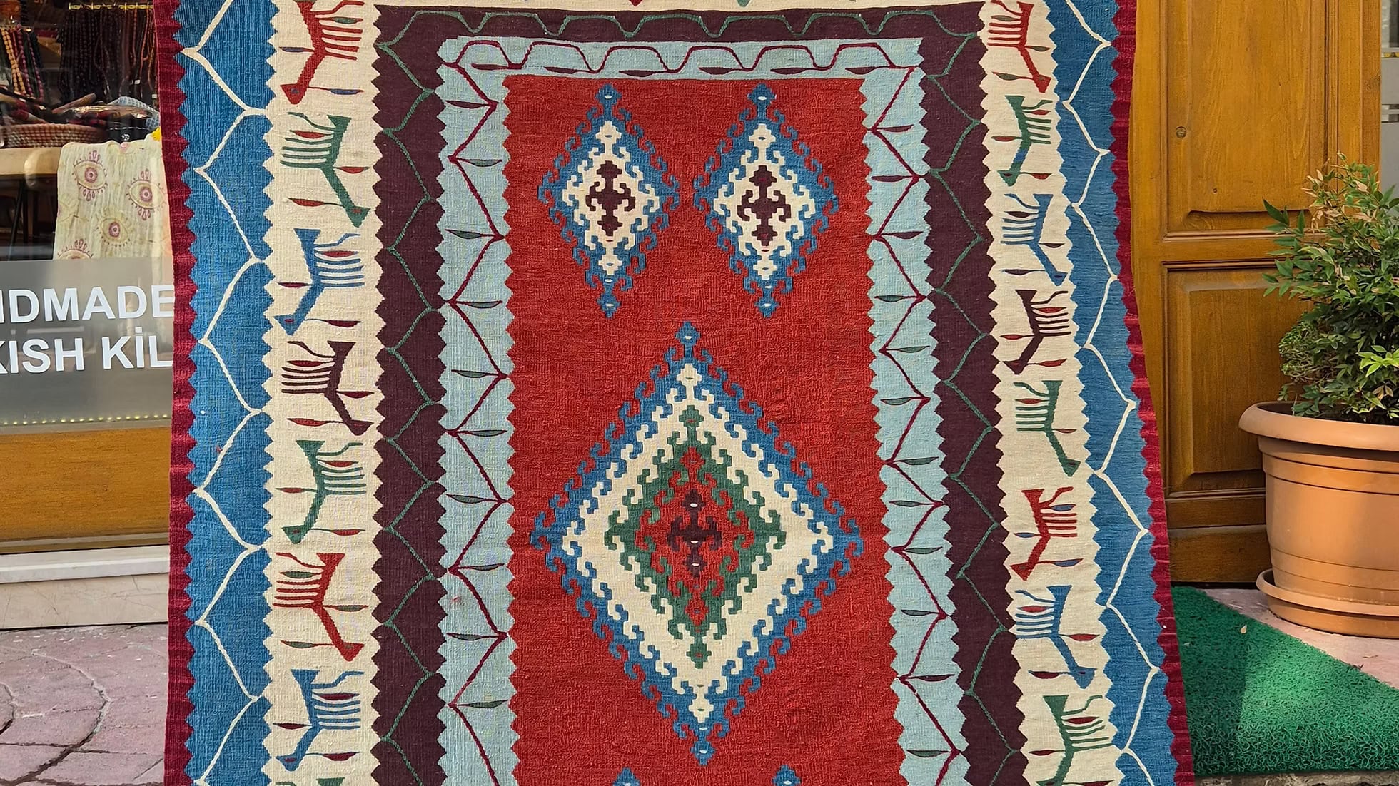 Handwoven Turkish accent rug with traditional motifs perfect for luxury event staging and rentals