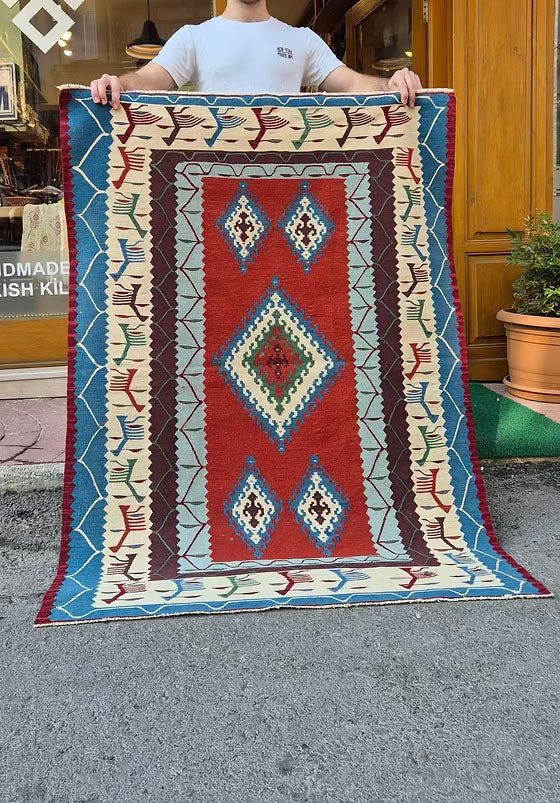 Handwoven Turkish accent rug with traditional motifs perfect for luxury event staging and rentals