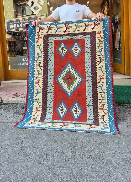 1980s Usak Anatolian accent rug featuring symbolic motifs and geometric patterns